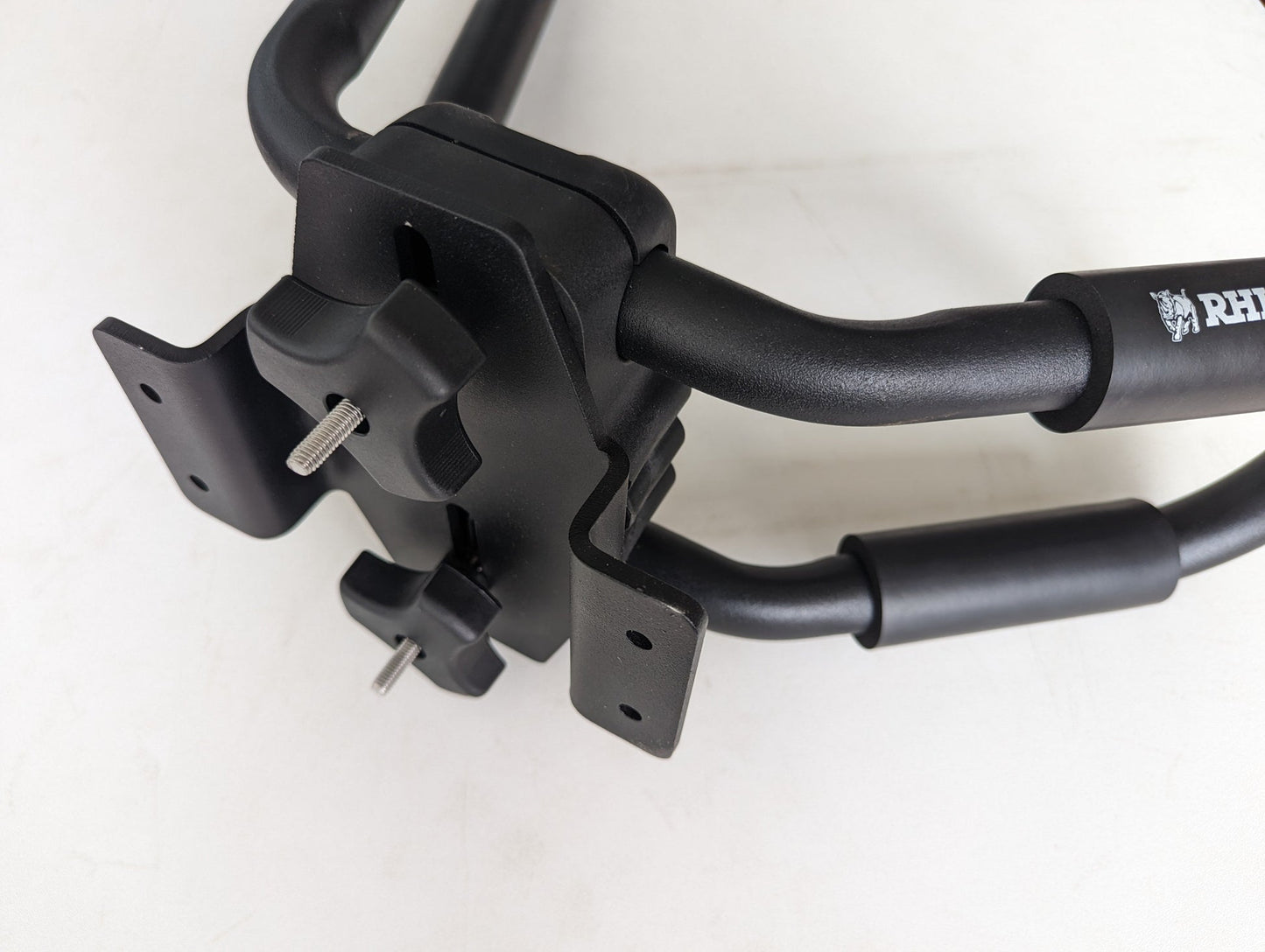 TRUKD Kayak/Gear Mount bracket bolted to a T Series crossbar with a J-hook kayak carrier attached