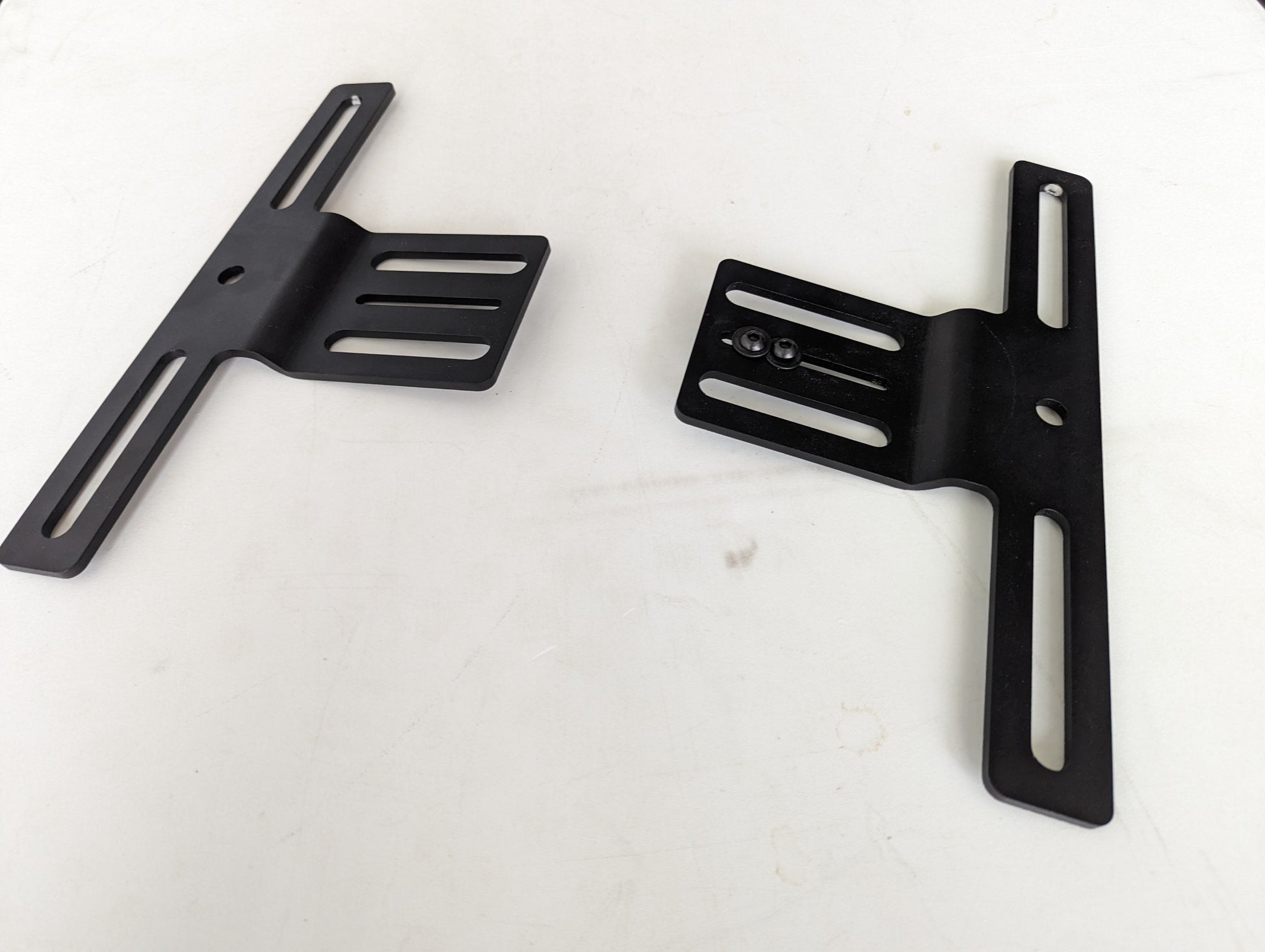 TRUKD traction board mount installed on a bed rack, angled detail view
