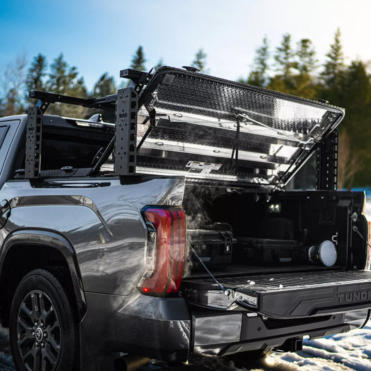 TRUKD T Series Double Decker Bed Rack with 24.5 inch uprights mounted over an open retractable tonneau cover on a Toyota Tundra